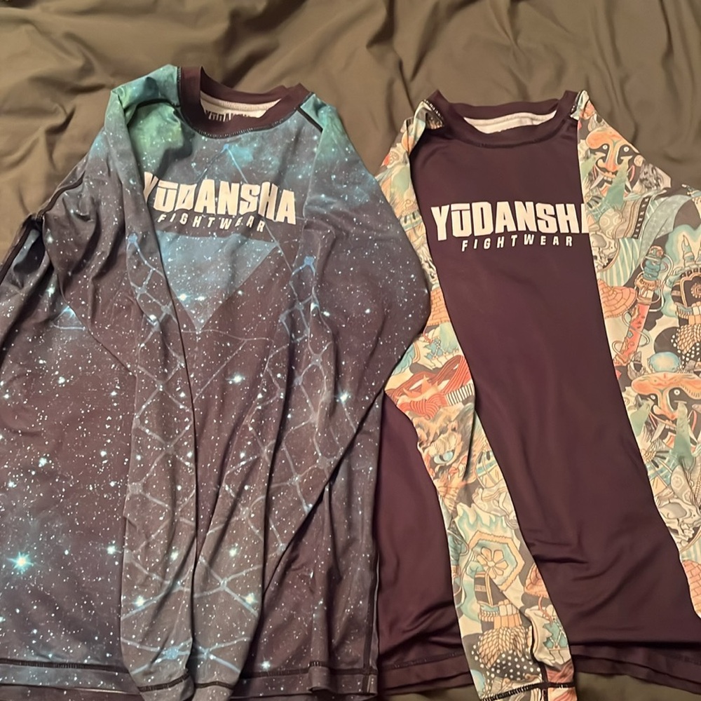 I am selling 2 Jiu jitsu rash guard Yudansha size L.